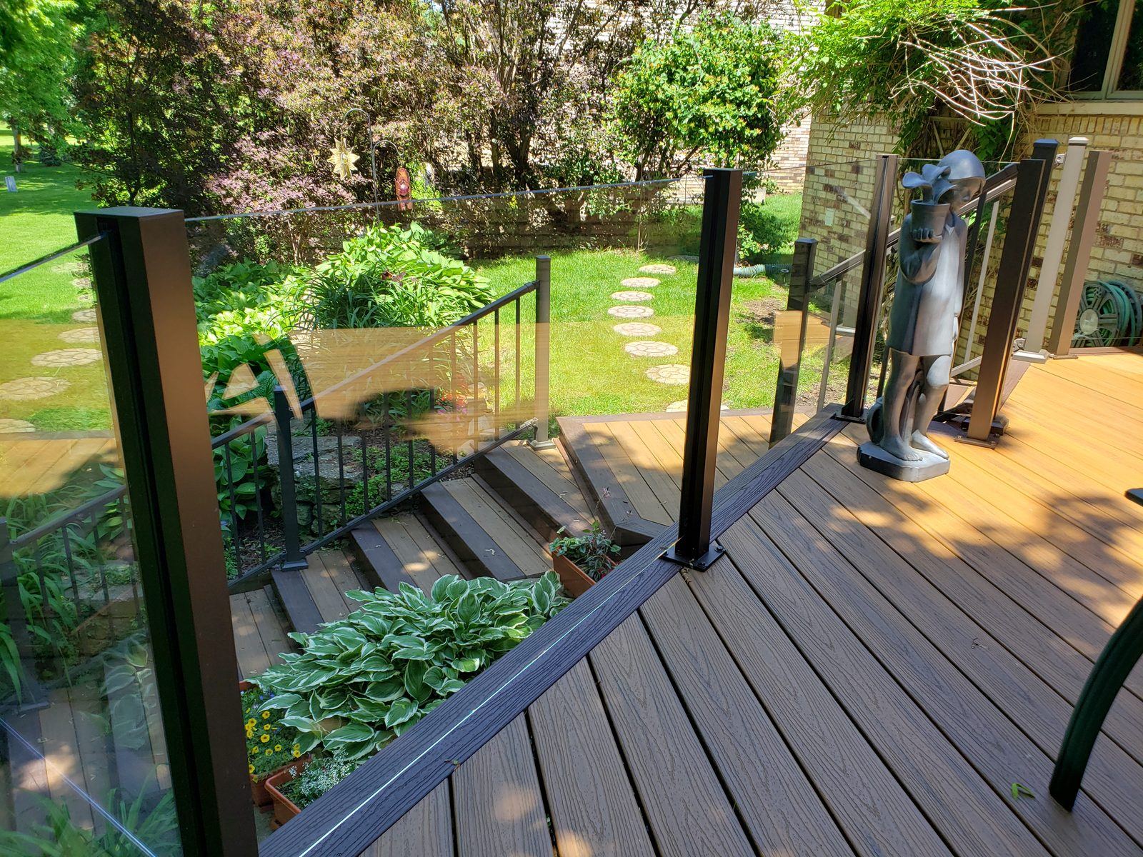 Falcon Topless Glass Rails — real project photo by Supreme Deck Builders, Southeast Michigan
