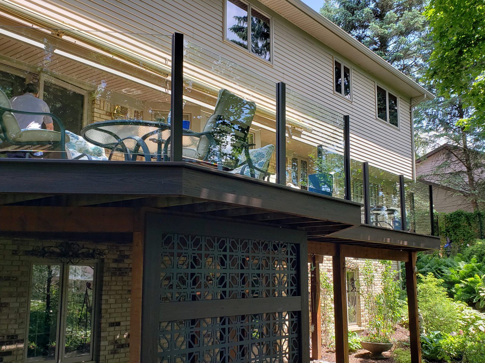 Falcon Topless Glass Rails — real project photo by Supreme Deck Builders, Southeast Michigan