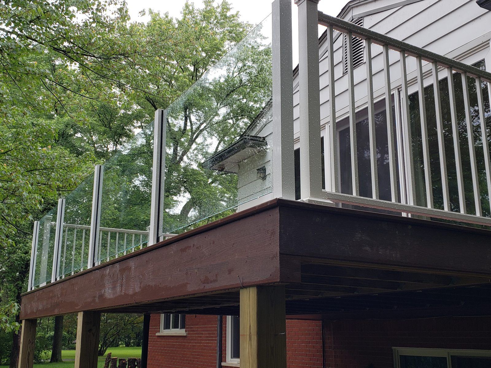 Falcon Topless Glass Rails — real project photo by Supreme Deck Builders, Southeast Michigan