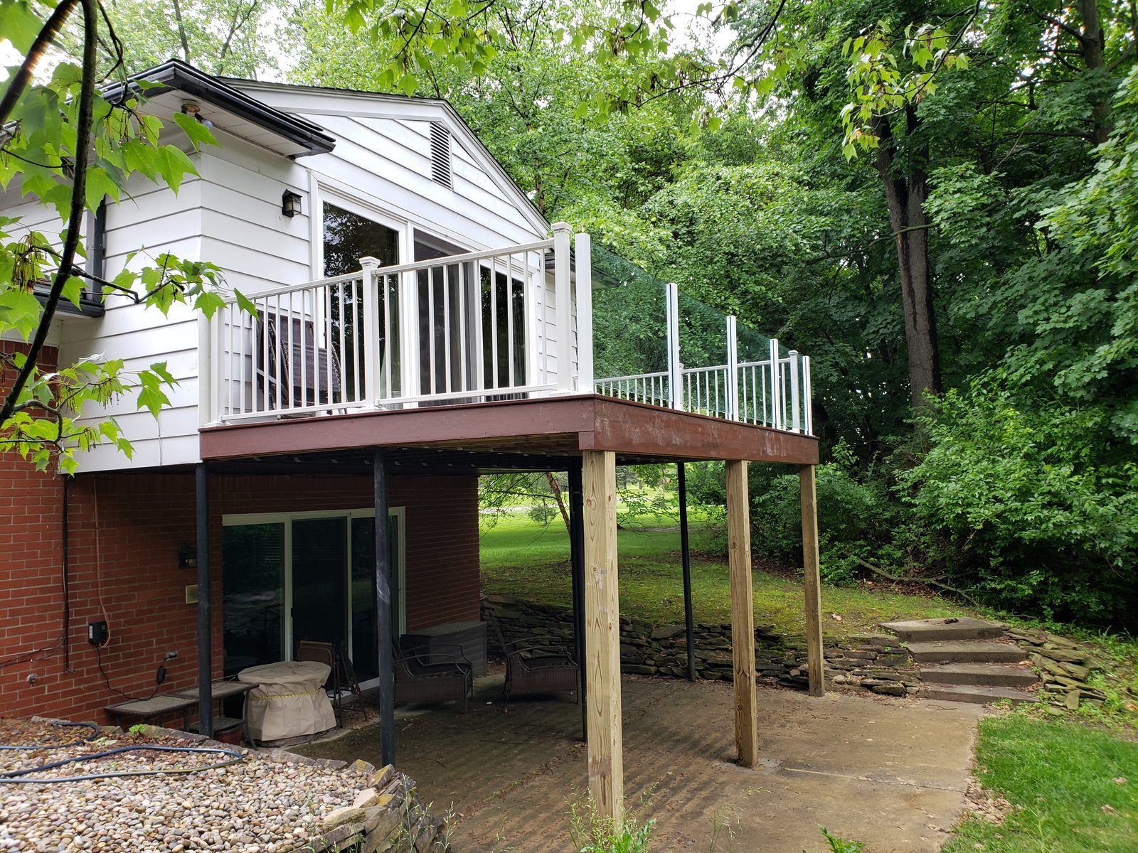 Falcon Topless Glass Rails — real project photo by Supreme Deck Builders, Southeast Michigan