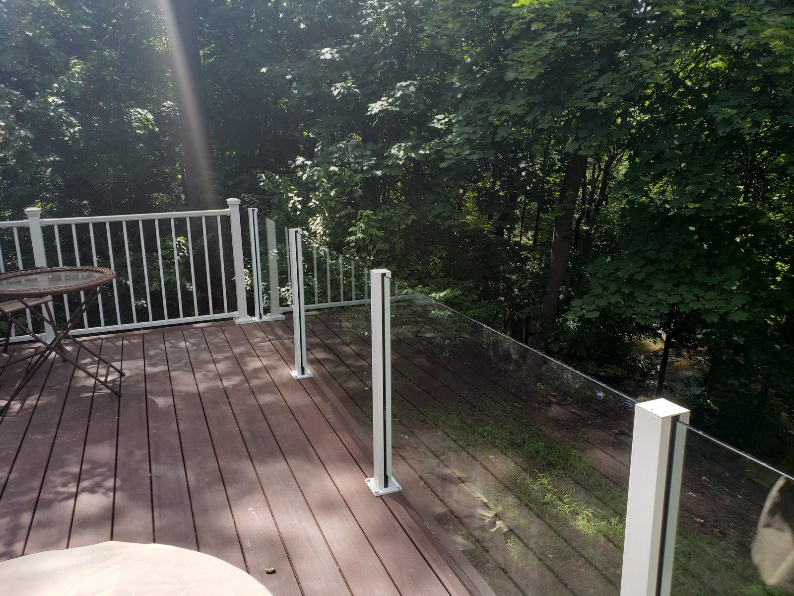Falcon Topless Glass Rails — real project photo by Supreme Deck Builders, Southeast Michigan