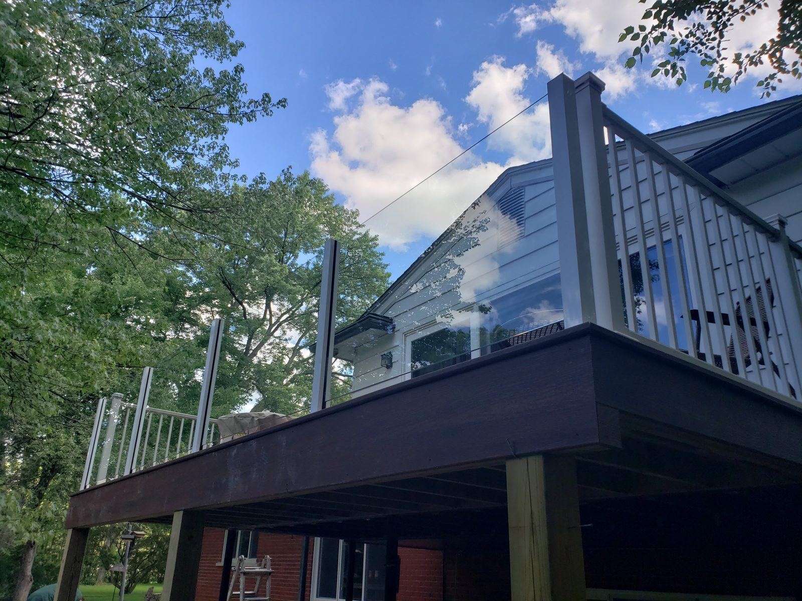 Falcon Topless Glass Rails — real project photo by Supreme Deck Builders, Southeast Michigan