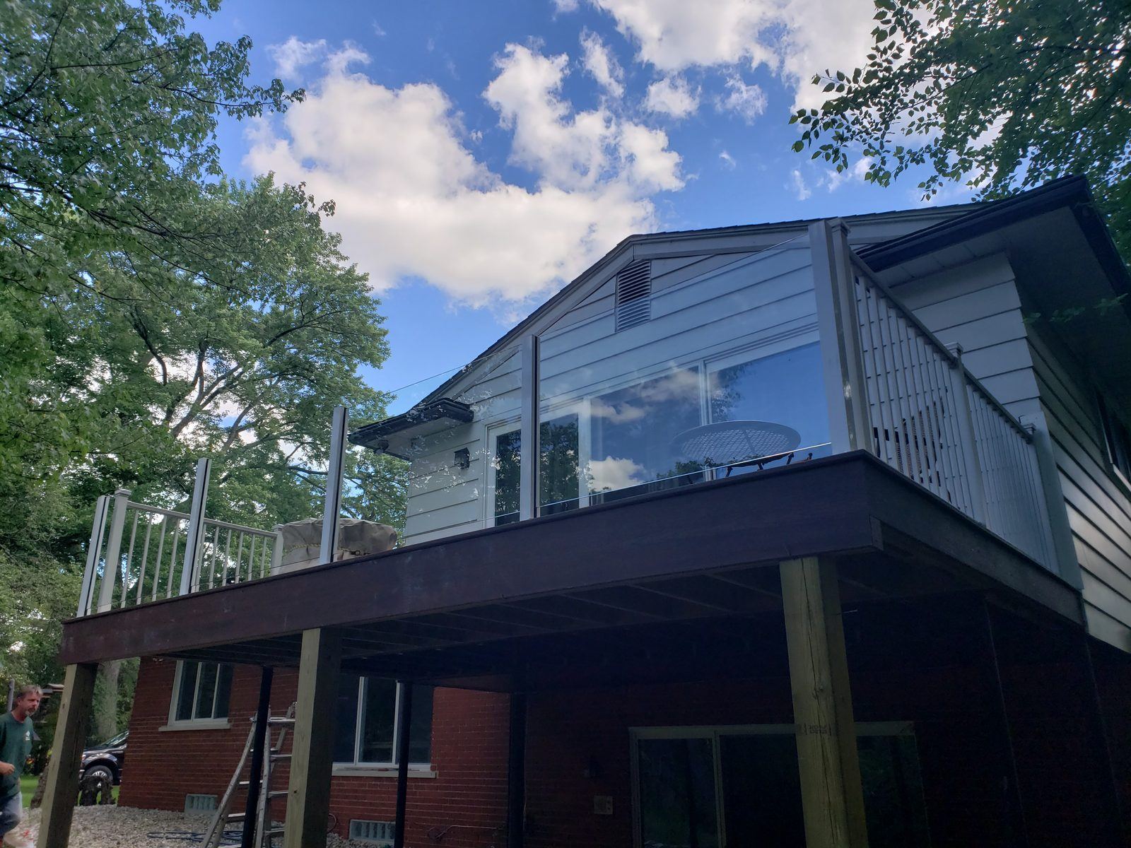 Falcon Topless Glass Rails — real project photo by Supreme Deck Builders, Southeast Michigan